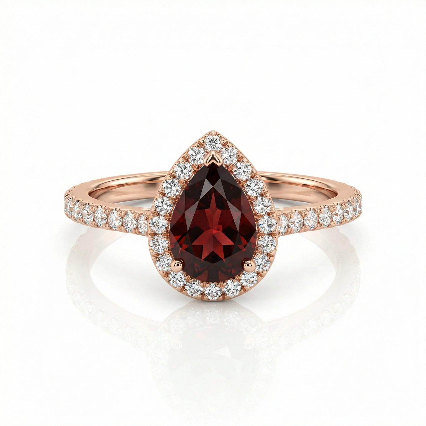 Auksinis lašo formos žiedas su granatu