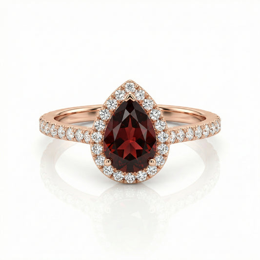 Auksinis lašo formos žiedas su granatu